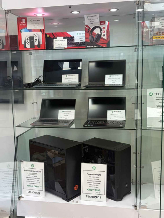 Various laptops and gaming PC's in a display cabinet